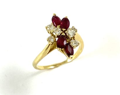 RING holding four navette rubies and six...