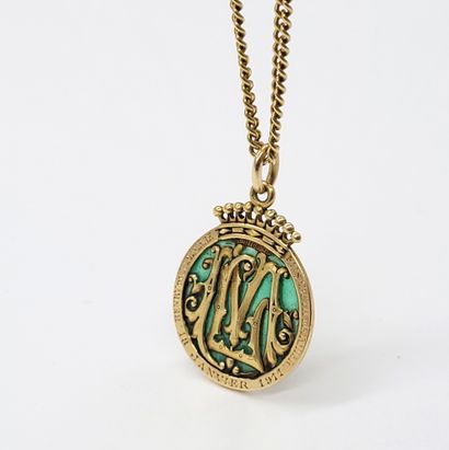 null Round pendant with an M and an L interlaced in green openwork enamel, it is...