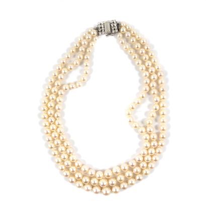 null NECKLACE holding three strands of white pearls (not tested) in fall. The clasp...