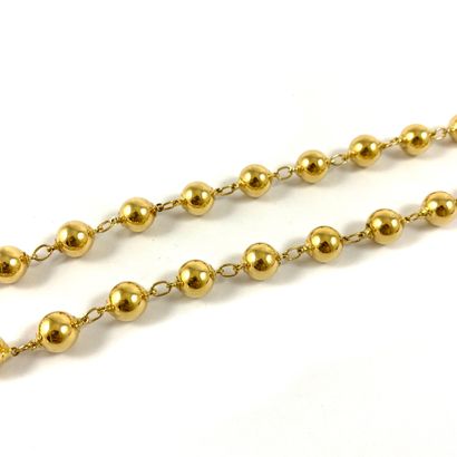null NECKLACE punctuated with a succession of balls. Mounted in 18K yellow gold....