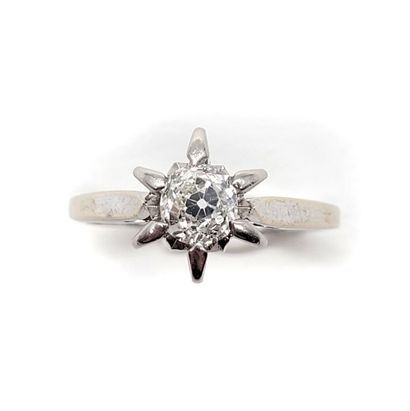 null RING holding an old cut diamond of 0.45 carat approximately. Mounted in 18K...