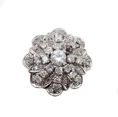 
RING 

holding a flower design paved with...