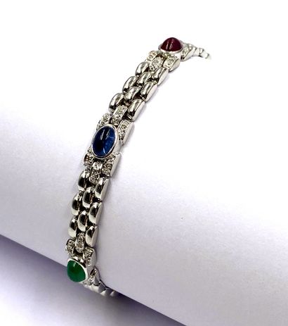 null BRACELET composed of three lines of oval links punctuated with cabochons of...