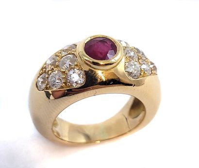 RING holding a round ruby with brilliant-cut...