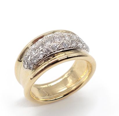 null RING composed of three godrons, the main one holding a pavement of brilliant-cut...