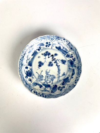  CHINA Suite of eleven porcelain saucers decorated in white and blue with the wreck...