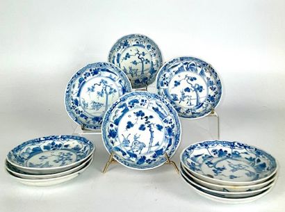 null CHINA Suite of eleven porcelain saucers decorated in white and blue with the...