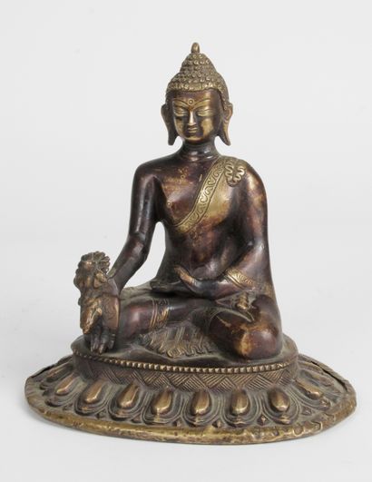 null CHINA, 20th century Bronze subject representing the Buddha seated in meditation...