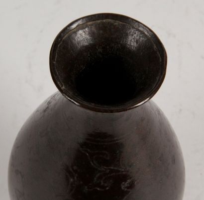 null CHINA, 17th century Small bronze piriform vase with brown patina, decorated...