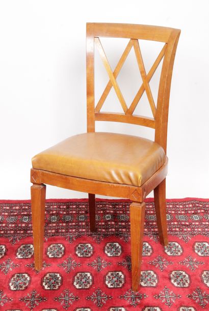 null TEN DINING ROOM CHAIRS, with cross back, in cherry wood. They rest on saber...