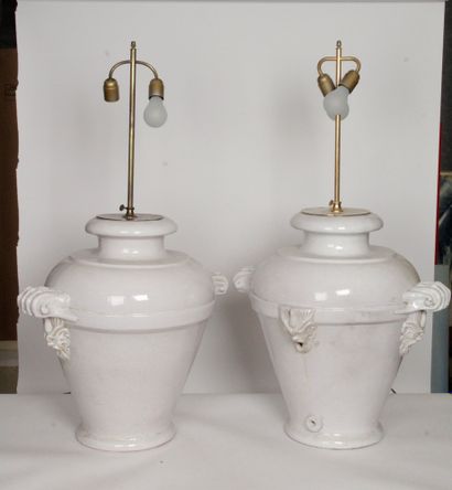 null IMPORTANT PAIR OF LAMP LEGS in white glazed earthenware decorated with mascarons...