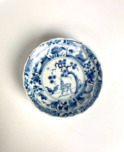 null CHINA Suite of eleven porcelain saucers decorated in white and blue with the...