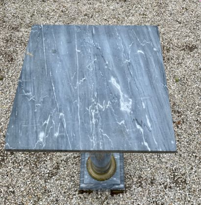 null SELETTE in grey veined marble with an ionic chasper in gilt bronze. Marble top....