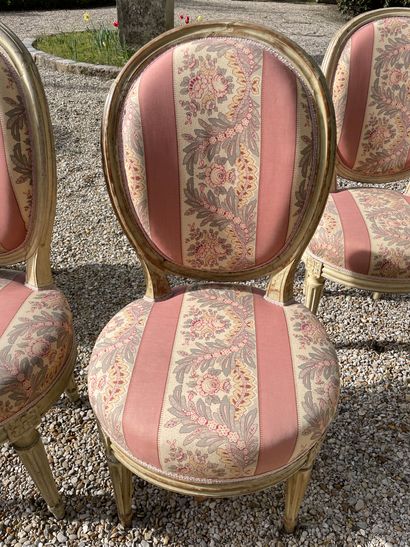 null FOUR chairs in relacquered wood with medallion back resting on four tapered...