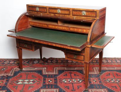 null CYLINDER DESK, in amaranth rosewood veneer, light wood fillets and stained wood...