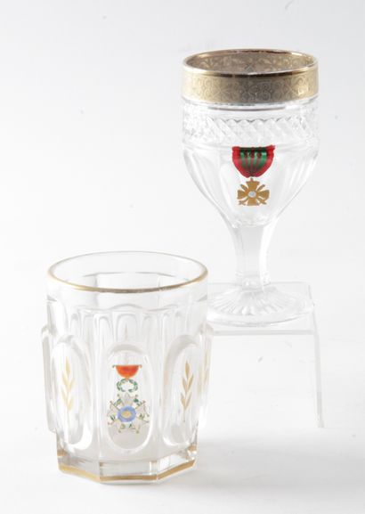  LOT OF TWO GLASSES in molded glass with gilded decoration, decorated with a legion...