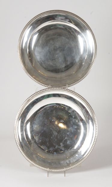 null TWO ROUND PLATES in silver with a frieze of palmettes Minerva mark Goldsmith...
