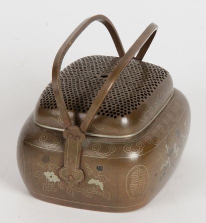 null Vietnam, circa 1900 Small hand warmer with double handle, in bronze with silver...