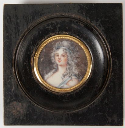 null MINIATURE of round form representing a young woman with long hair and a blue...