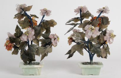 null CHINA, 20th CENTURY Pair of flowering planters, the pot in green serpentine,...