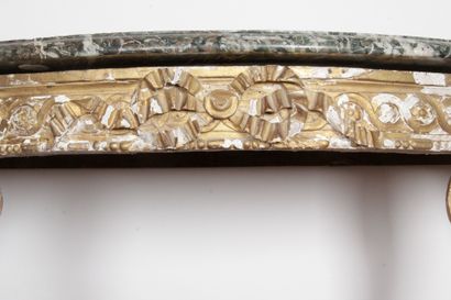 null LARGE CONSOLE of half-moon shape, in gilded wood, molded and carved, of ribbon...