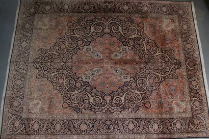 null SILK CARPET with central medallion in the form of stylized diamond, on old pink...