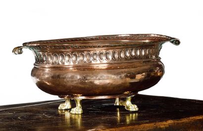 null COPPER DISH in embossed copper resting on bronze feet in the form of clawed...