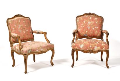 null TWO LARGE QUEEN'S ARMCHAIRS in walnut richly carved with staples and leafy cartouches,...