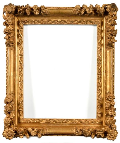 Gilded wood frame richly carved with flowers...