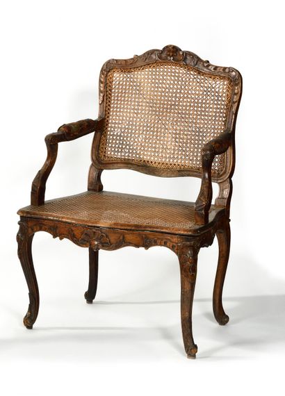 null Carved and molded walnut cane armchair with flat back decorated with flowers...