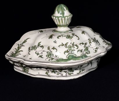 null MOUSTIER, earthenware planter decorated in green monochrome of flowers, the...