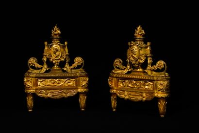 PAIR OF CHENETS in chased and gilded bronze...
