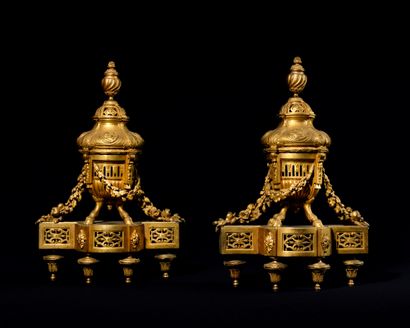 null BEAUTIFUL PAIR OF CHENETS in chased and gilded bronze decorated with openwork...
