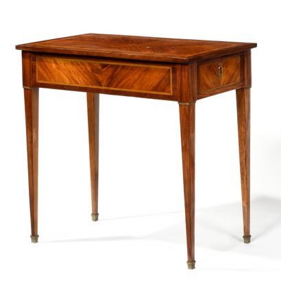 null Rosewood veneer SALON TABLE opening to a drawer on the side. The feet tapered...