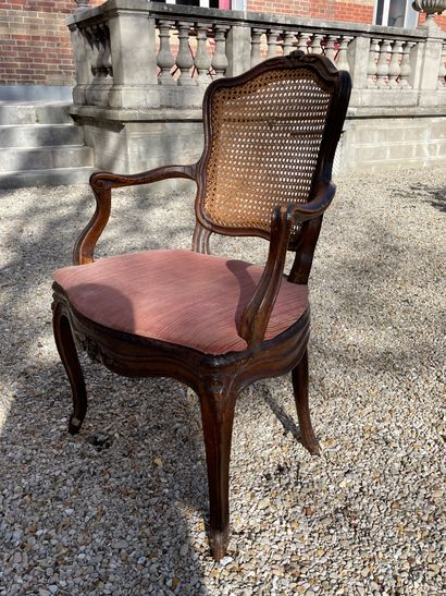 Caned armchair in natural wood, molded and...