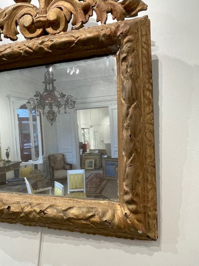 null Rectangular mirror with carved and openworked pediment in gilded oak. 18th century...