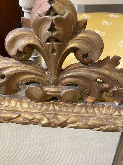 null Rectangular mirror with carved and openworked pediment in gilded oak. 18th century...