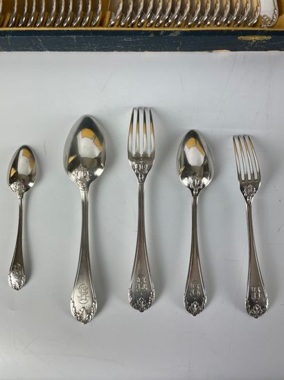 null MENAGERE in silver chased with foliage including: -17 table forks -18 table...