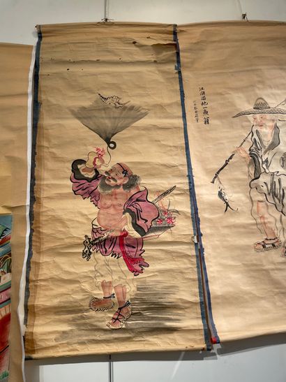  CHINA Four scrolls on paper with painted scenes. Early 20th century (Some tears...