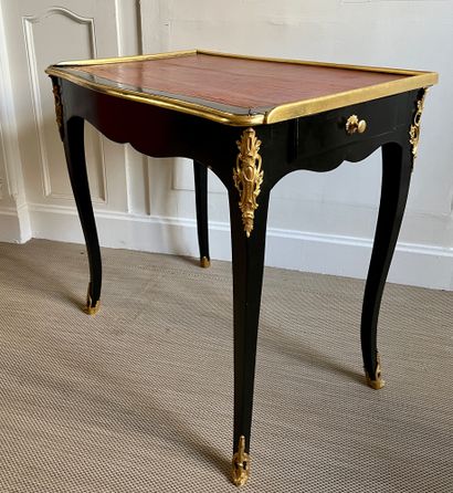 WRITING TABLE in gilded wood opening with...