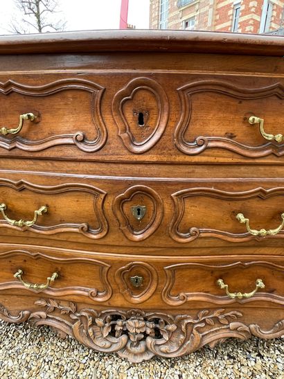 null WOODEN COMMODE in molded and carved walnut opening with three drawers in front,...