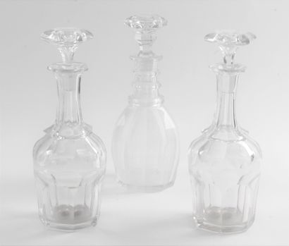 null 
THREE CARAFES and their stoppers in faceted crystal. Period: 19th century....