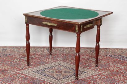 null A Louis Philippe period game table with a mahogany wallet top, mahogany veneer...