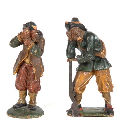 null Pair of carved and polychromed wood subjects representing a hunter and a shepherd....