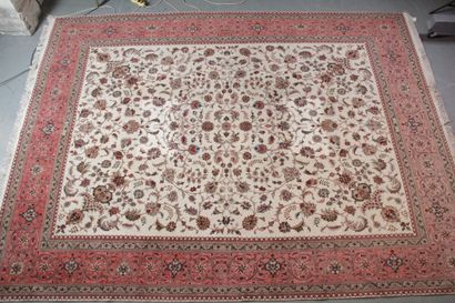  LARGE TABRIZ CARPET (mid 20th century) with ivory field decorated with scrolls and...