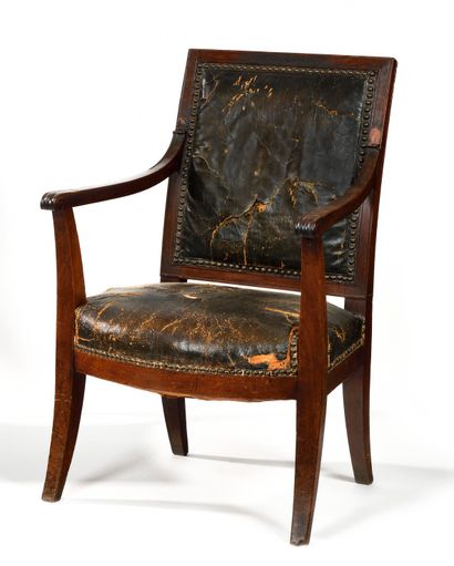 null Carved and molded mahogany armchair, the square back, arched belt, saber feet....