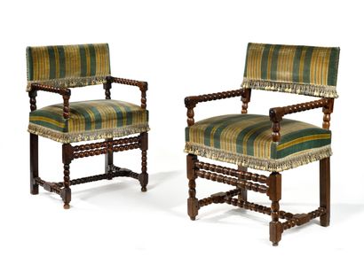 null SUITE OF TWO CHAIRS AND ARMCHAIRS, the front legs connected by a double row...