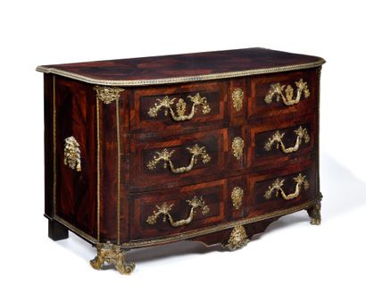 null BEAUTIFUL COMMODE in rosewood opening with four drawers, the top with ironwork...