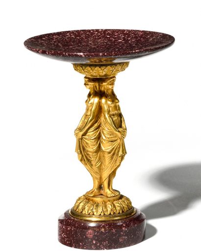 CUP ON FOOT in finely chased and gilded bronze,...