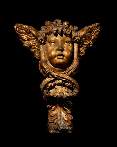 IMPORTANT PUTTO in carved and gilded wood...